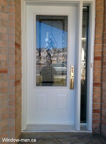 White Front door with sidelight installation. Three quarters glass and full glass sidelight. North Bay Classic stained glass catalog. Beveled Glass with patina caming